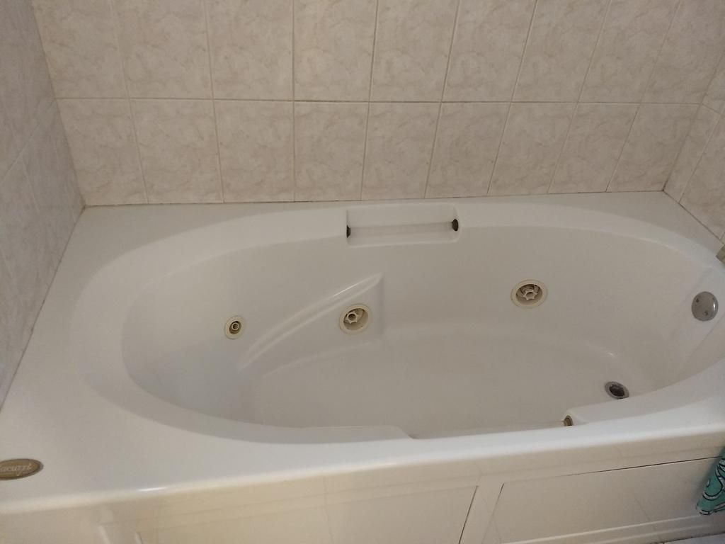 Gleaming jetted tub after cleaning
