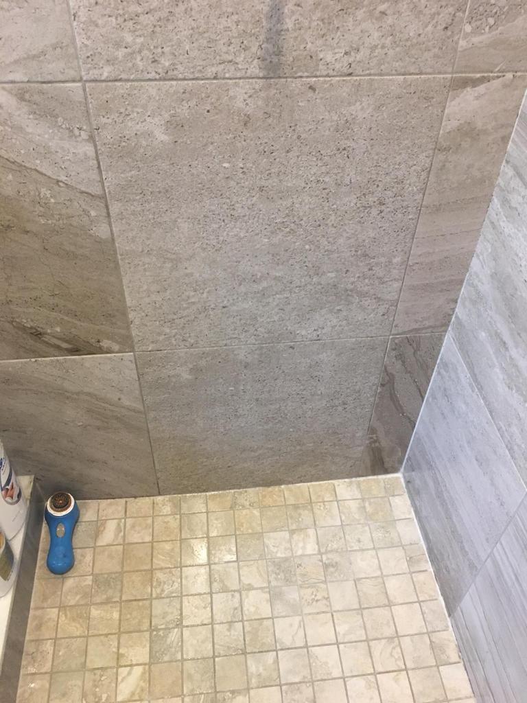 Clean shower floor tiles and grout after cleaning
