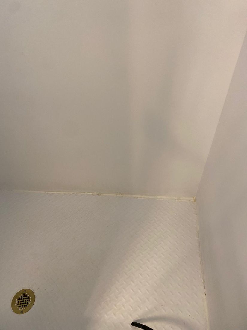 Clean white shower pan after cleaning