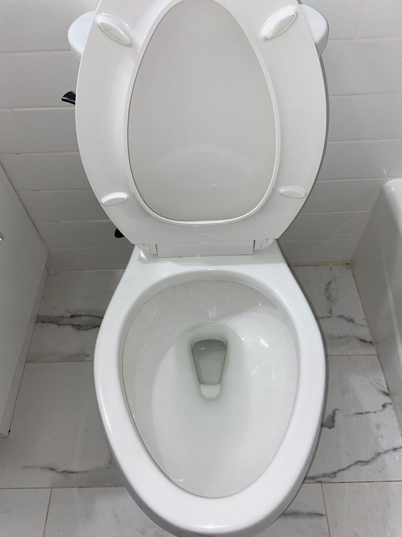 Spotless white toilet bowl after cleaning